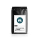 Black coffee bag with a label on a white background. Taylors Trail logo Fresh roasted coffee French vanilla Flavored 