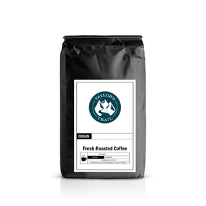 Black coffee bag with a label on a white background Taylors trail logo blonde fresh roasted coffee 